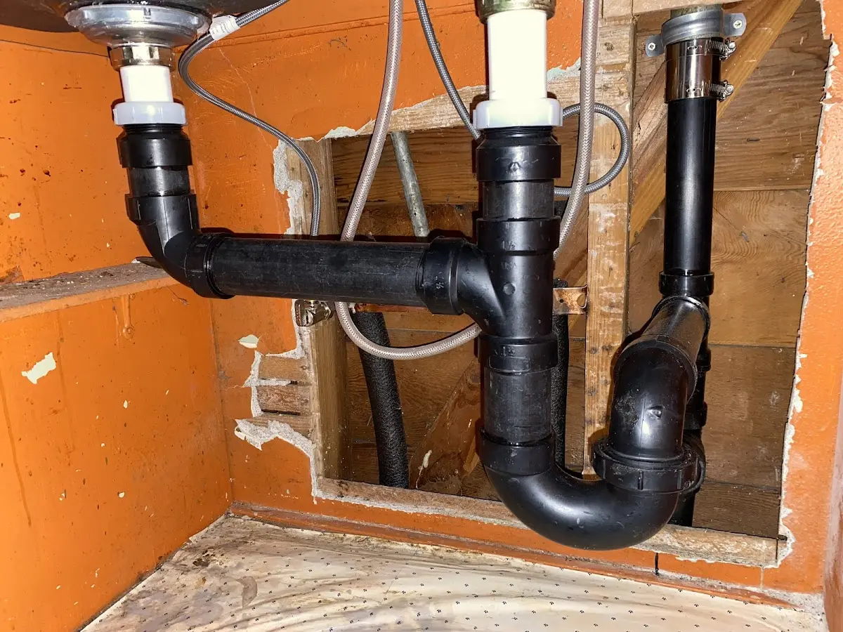 Professional Garbage Disposal Repair equipment and tools on the job in Longview
